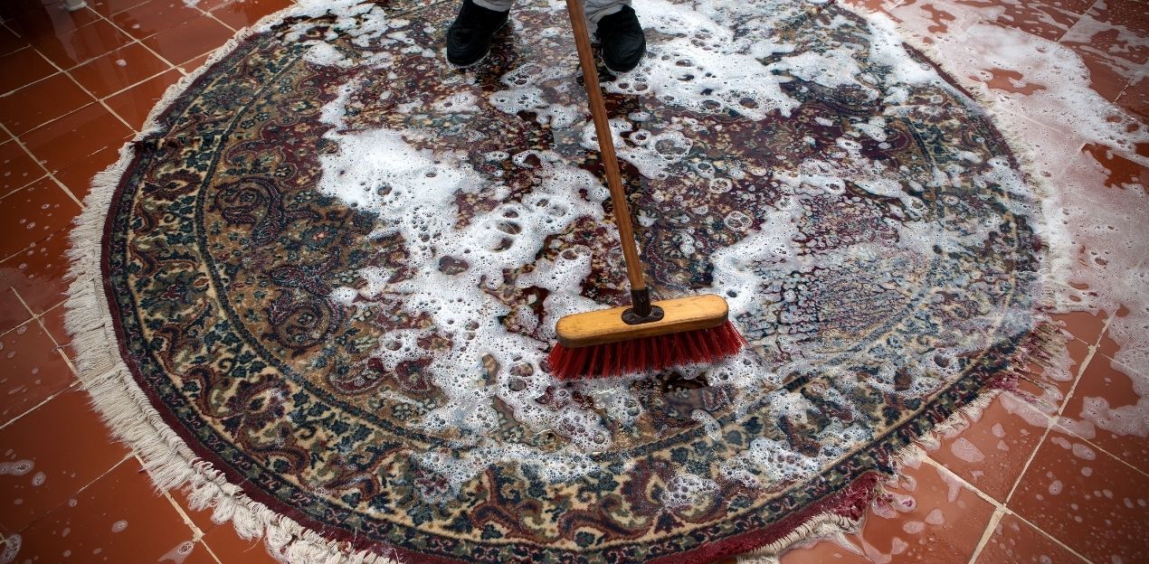 a muddy carpet getting cleaned a muddy carpet getting cleaned